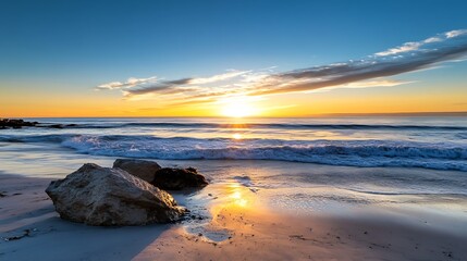Naklejka premium Beautiful beach landscape with golden sands and vibrant sunset reflecting on gentle ocean waves : Generative AI