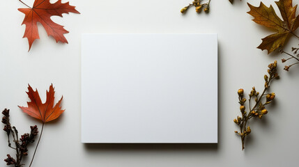 Blank canvas surrounded by autumn leaves and branches