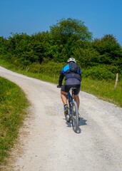 Naklejka premium A person cycling on a rural route