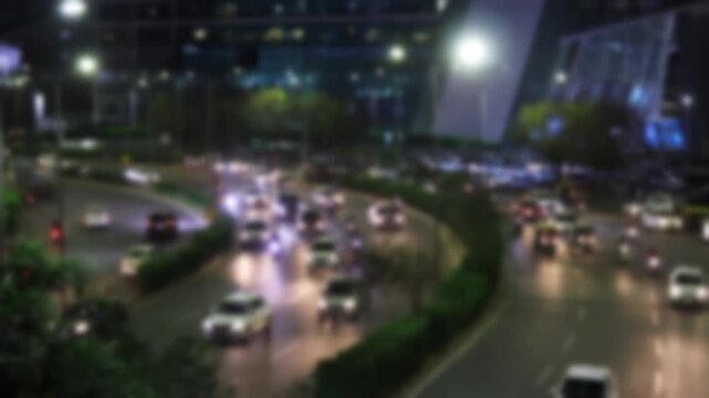 Blurred view of a busy evening road traffic in Cyber City, Gurugram, Haryana, India. Top angle view. Background motion video