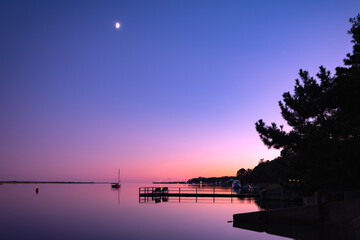 Cape Cod Sunset Seascape at Moonrise, Hyannis Beach Port, Barnstable, Massachusetts, USA: Tranquil evening landscape of the Atlantic Ocean Shore in New England of America