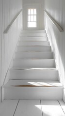 Obraz premium White wooden staircase leading to a door with sunlight streaming through.