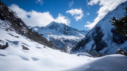 Obraz premium Majestic snowy mountain landscape under a bright blue sky with fluffy clouds : Generative AI