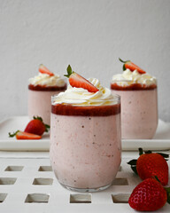 Strawberry mousse cups with whipped cream