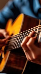 Fototapeta premium Close-up of Hands Playing Acoustic Guitar with Melodic Harmony in Soft Indoor Lighting