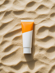 Bright and modern sunscreen tube with a vibrant orange cap, set against soft sandy textures. Ideal for sun protection, this sleek design is perfect for beach days and outdoor adventures