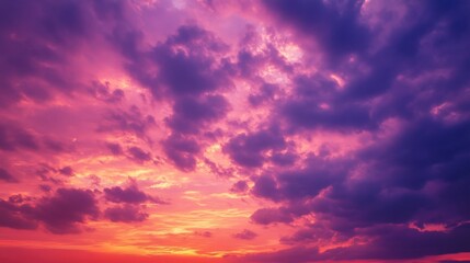 Obraz premium Crimson red and lavender cloudscape creating a magical sunset glow