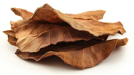 Dried tobacco leaves stacked, close-up, white background, nature