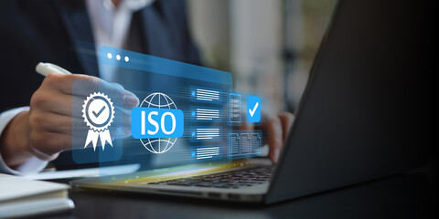 Digital ISO certification and compliance management, Business professional managing ISO certification and compliance using digital tools, focusing on quality assurance and documentation processes.