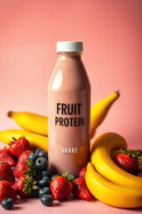 A fruit protein shake, featuring strawberries, blueberries, and bananas, against a pink backdrop.