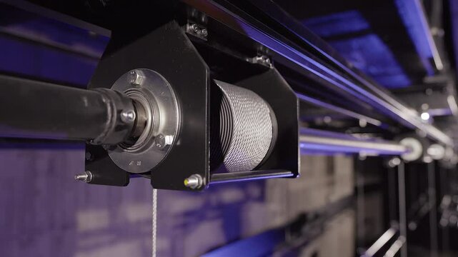 Metal Cable Rolls In a Hoist Spool. Equipment for Stage Truss. Lighting or Stage Truss Allows Lighting Designers the Freedom to Hang LED or Automated Fixtures, Where Ever they Choose.