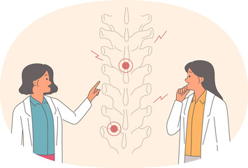 Injured spine is examined by two female doctors, discussing possibility of using alternative medicine. Girl chiropractor explains methods of treating spine using chiropractic and massage
