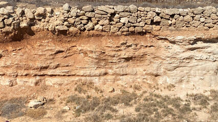 Texture of the stones red wall earth