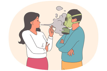 Fototapeta premium Problem passive smoking causes discomfort for man using gas mask, standing near woman with cigarette