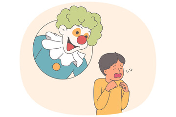 Hysterical behavior of little boy, seeing clown and frightened due to coulrophobia