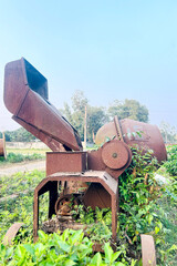 Abandoned Rusty Concrete Mixer in Overgrown Field