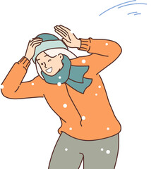 Happy woman plays snowball and dodges snow flying at head, rejoicing in arrival of winter days. Young girl takes part in game of snowball during christmas holidays or new year weekend.