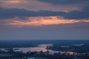 The Vistula river flowing in winter, winter landscape, Sunset landscape. countryside landscape.