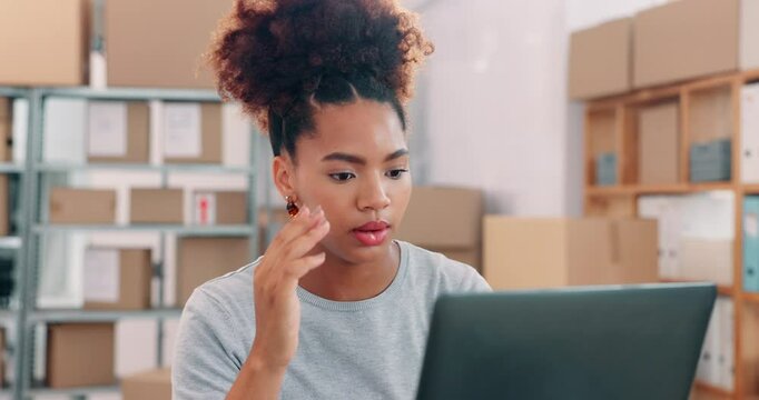 Laptop, logistics and stress with black woman in office for management of delivery or distribution schedule. Box, computer and problem solving with employee in supply chain depot for backlog or delay