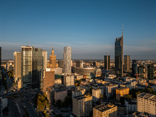 Obraz premium downtown of big capital city with skyscraper towers and modern tall office buildings, skyline and contemporary architecture of financial district, Warsaw, Poland, aerial top view