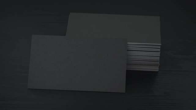Stack of black blank business cards mockup on black table 3d animation