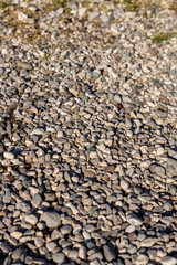 Gravel surface with small stones in a natural outdoor setting during daylight