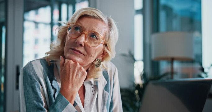 Thinking, reading and mature woman with laptop, bookkeeper and planning for payroll in office or digital. Business, serious and person with glasses of financial report, contemplating or tax deduction