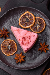 A piece of sweet cheesecake with raspberry or strawberry flavor