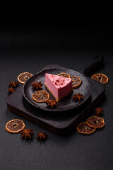 A piece of sweet cheesecake with raspberry or strawberry flavor