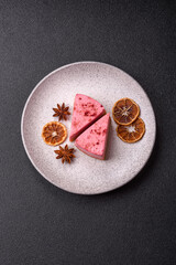 A piece of sweet cheesecake with raspberry or strawberry flavor