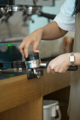 Barista Preparing Espresso at Coffee Machine	