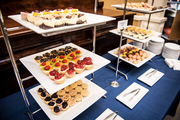 Tiers of white dessert trays. 