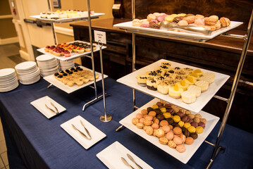 Tiers of white dessert trays. 