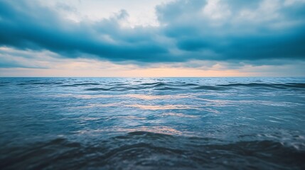 Calm ocean waters under a cloudy sky at twilight creating a serene atmosphere : Generative AI