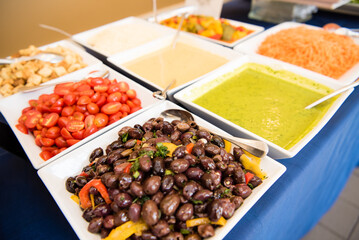 Dishes of salad toppings.