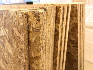 Exploring the texture and layers of engineered wood in a workshop setting