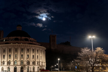 The headquarters of Water Supply and Sewerage Skopje illuminated at night. This modern building serves as the main office for the city's water management services.