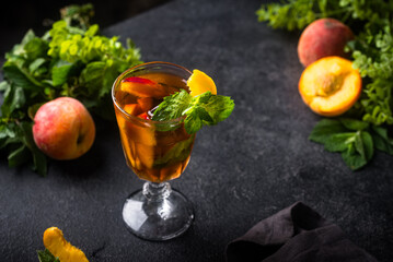 Cold ice tea with peach and mint