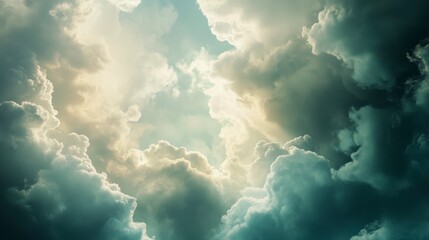 Dramatic cloudscape, sunlight piercing through, vast sky, powerful weather, potential for inspirational imagery