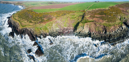 Aerial view of the Ballycotton Cliff Walk, County Cork, Ireland, showcasing the stunning coastal trail along rugged cliffs overlooking the Atlantic Ocean