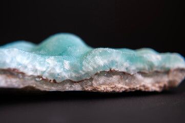 Blue hemimorphite isolated on black background