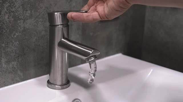 Hand washing process, hands include water in faucets and thorough cleansing technique with running water, foaming hands, rinsing and removing excess moisture in clean bathroom