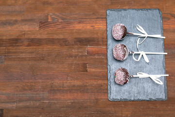 Delicious sweet chocolate cake pops,popsicles decorated white sprinkles,pastry,desserts on stick. Tasty food