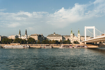 Fototapeta premium modern river bank side with bridge and churches in front 