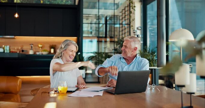 Laptop, conversation and mature couple with high five in home booking flight for anniversary weekend trip. Happy, love and people with computer cheering for hotel accommodation discount for vacation.