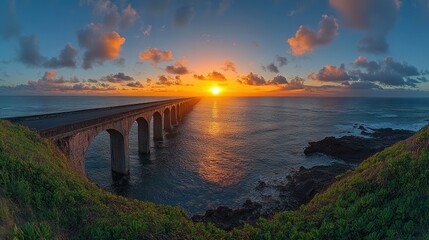 Fototapeta premium Scenic sunset over arched coastal bridge