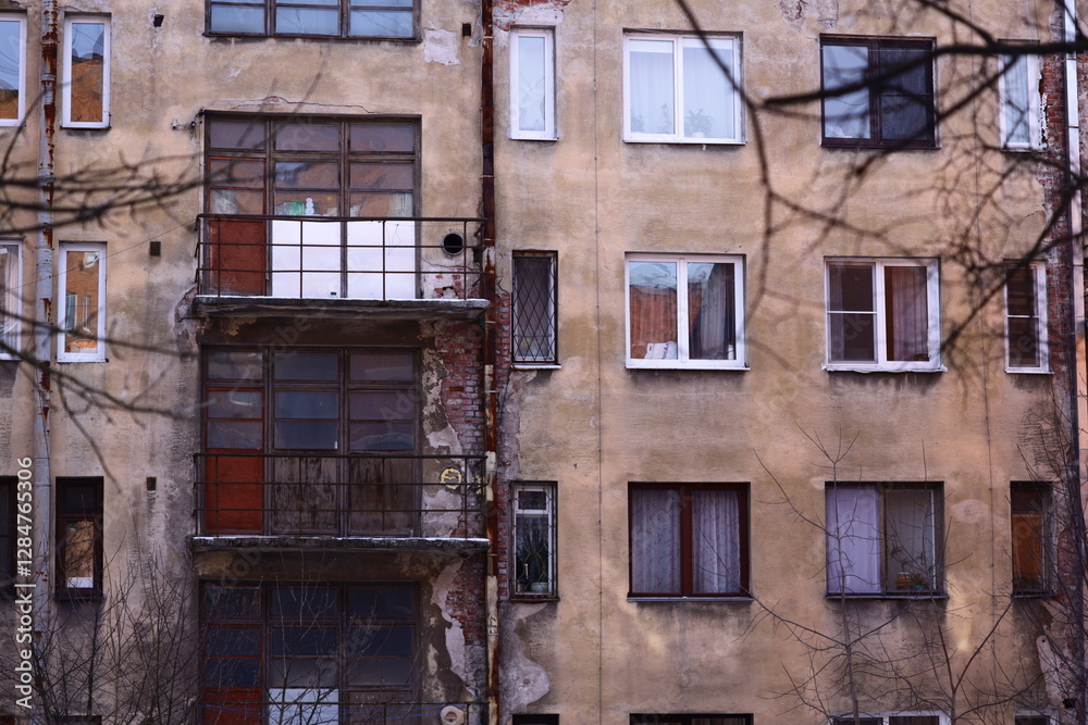 Poster Tall building with multiple windows.