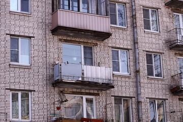 High-rise residential building with interconnected balconies.