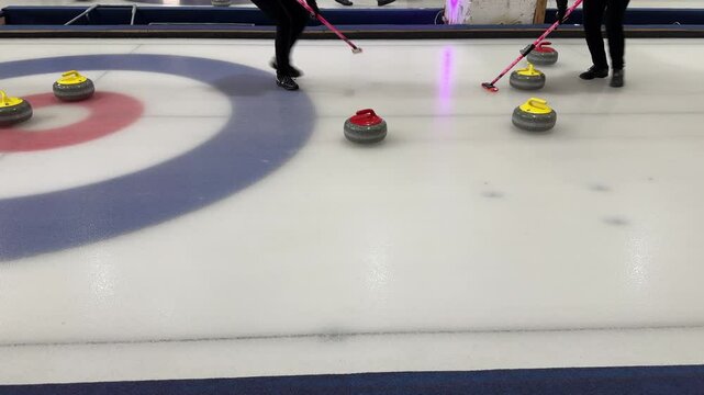 Granite stones for curling on white ice close-up.Winter sport, team game.Curling Club. 4K video. Brno, Europe