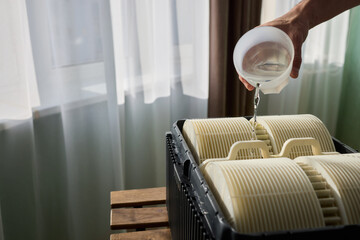 Pouring liquid into a storage container daily improves organization and efficiency